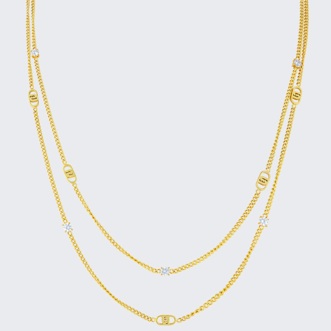 Collar múltiple dorado Liujo con logotipo grabado y brillantitos, de 120 cm