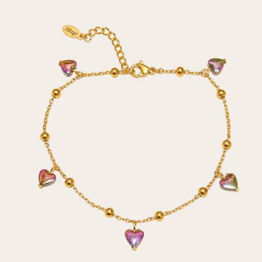 Tobillera dorada de acero inoxidable con baño de oro y corazones de hematita de Sfinge