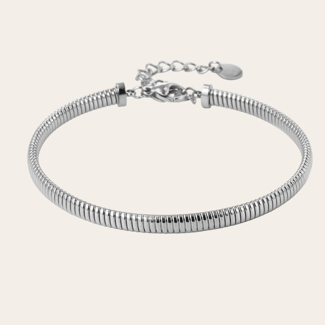 Brazalete fino flexible tipo tubo efecto muelle con cierre y extensión