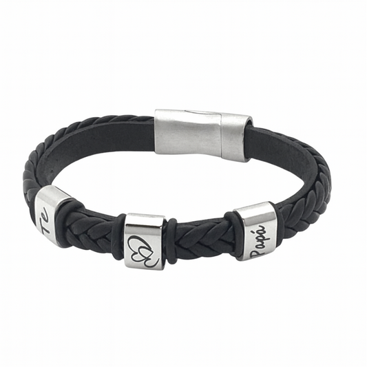 Pulsera personalizada de cuero trenzado negro con detalles en acero inoxidable grabados, diseño unisex de Sfinge.