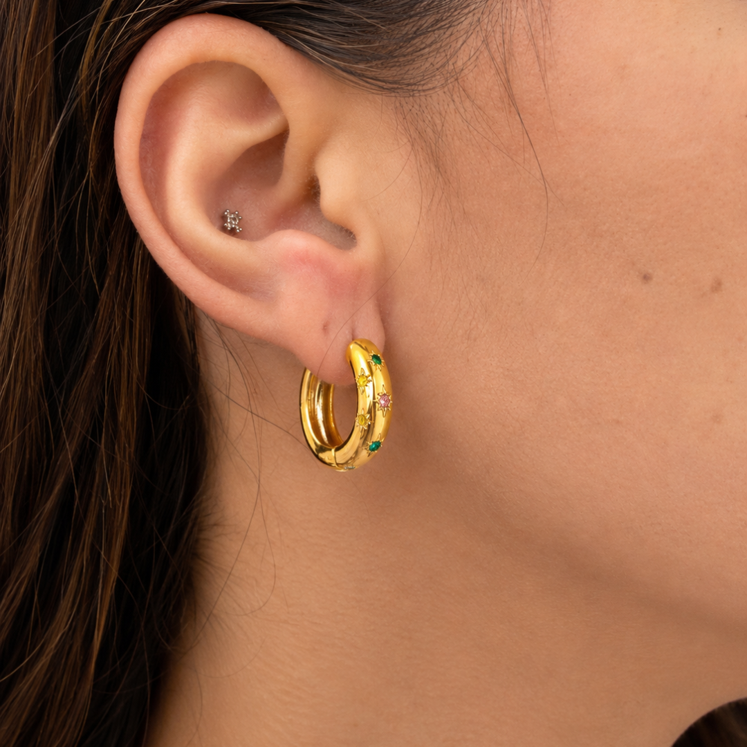 Pendientes en acero inoxidable dorado con circonitas en estrellitas sfinge