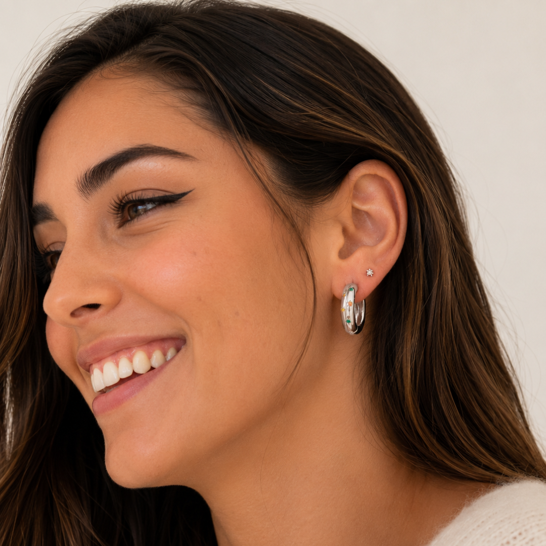 Pendientes en acero inoxidable plateado con circonitas en estrellitas sfinge
