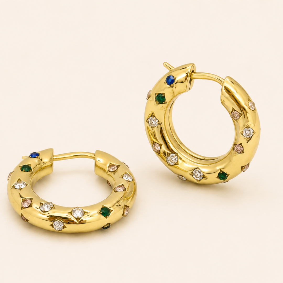 Aros multicolor de acero inoxidable de Sfinge disponibles en plateado y dorado con baño de oro